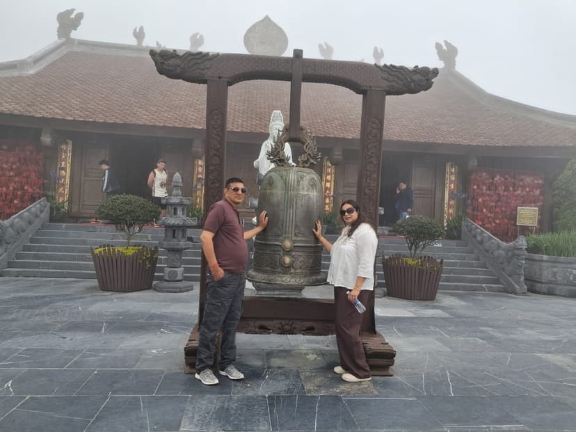 Couple at Fansipan temple bell, Vietnam — package from Vijayawada · Blindfold Trips