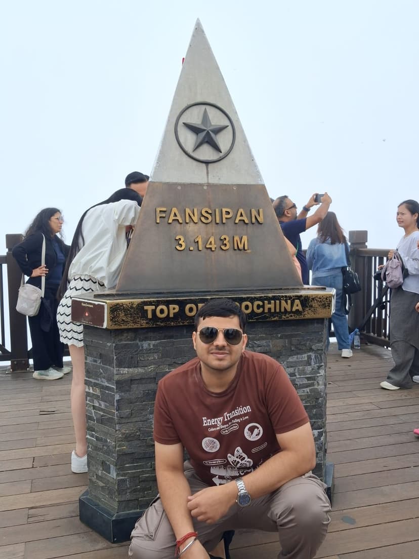 Traveller at Fansipan summit, Top of Indochina, Vietnam — package from Vijayawada · Blindfold Trips